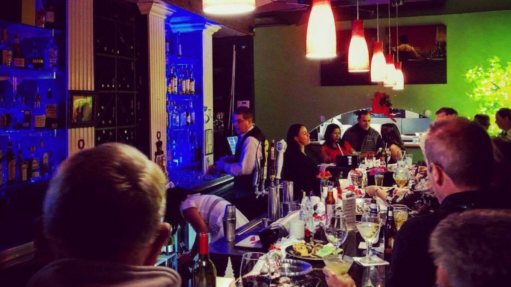 Guests enjoying authentic Italian dining and handcrafted cocktails at Giovanni's Italian Steakhouse near Jamestown NC in a welcoming fine dining atmosphere.