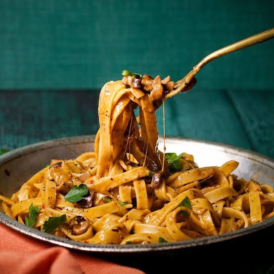 Handmade pasta with creamy mushroom sauce served at Giovanni's Italian Steakhouse, offering authentic Italian pasta near High Point NC.