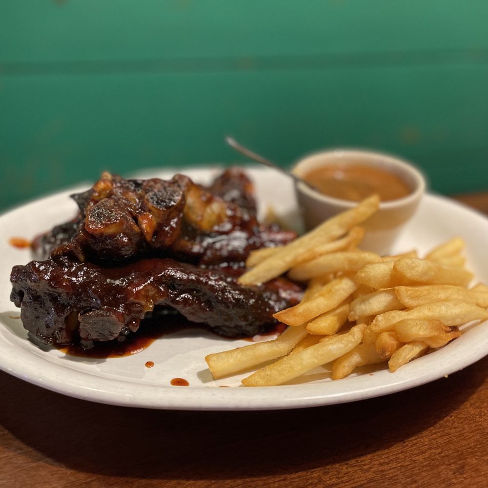 Succulent ribs served with crispy French fries and parsley at an Italian steakhouse in Greensboro, NC