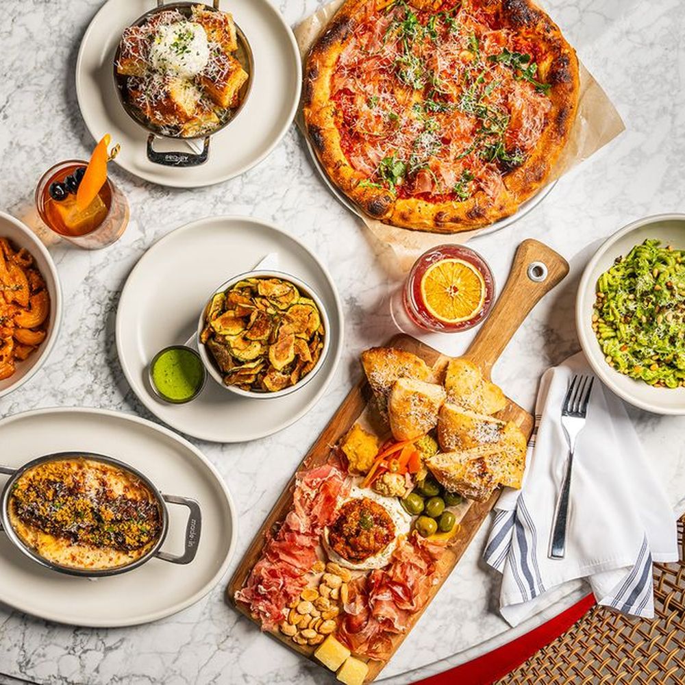 Seafood and Italian dishes served on a restaurant table in Greensboro NC