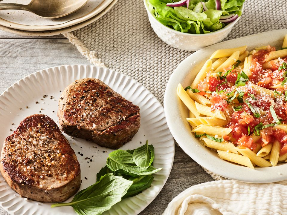 Italian pasta dishes with meat and fresh tomatoes at Giovanni’s Italian Steakhouse in Greensboro NC