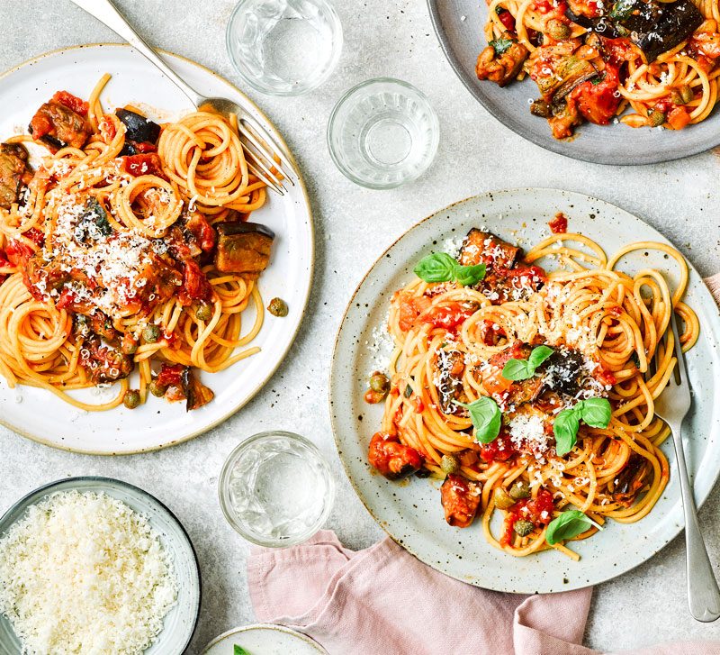 Spaghetti pasta dishes served on a dining table at an Italian restaurant in Greensboro NC