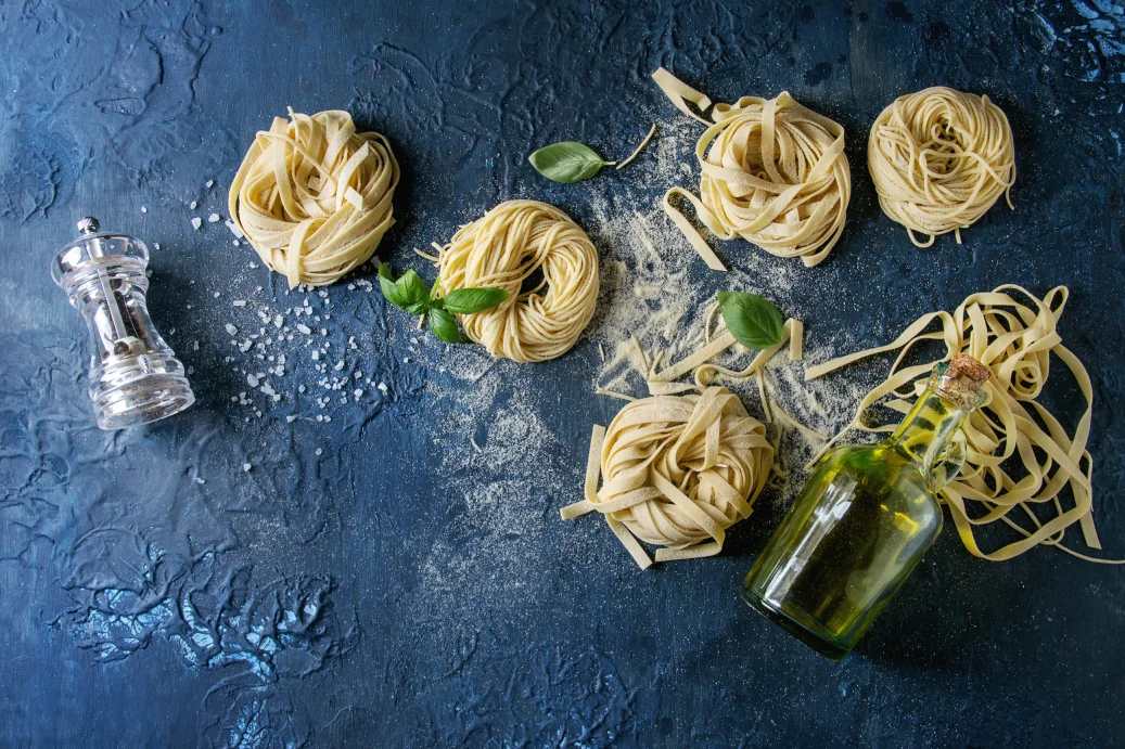 Spaghetti pasta drizzled with olive oil and seasoned with salt